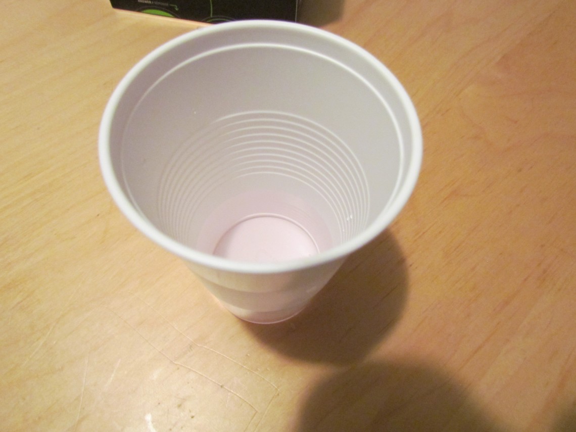 Chlorine in tap water DPD test results in a white cup.
